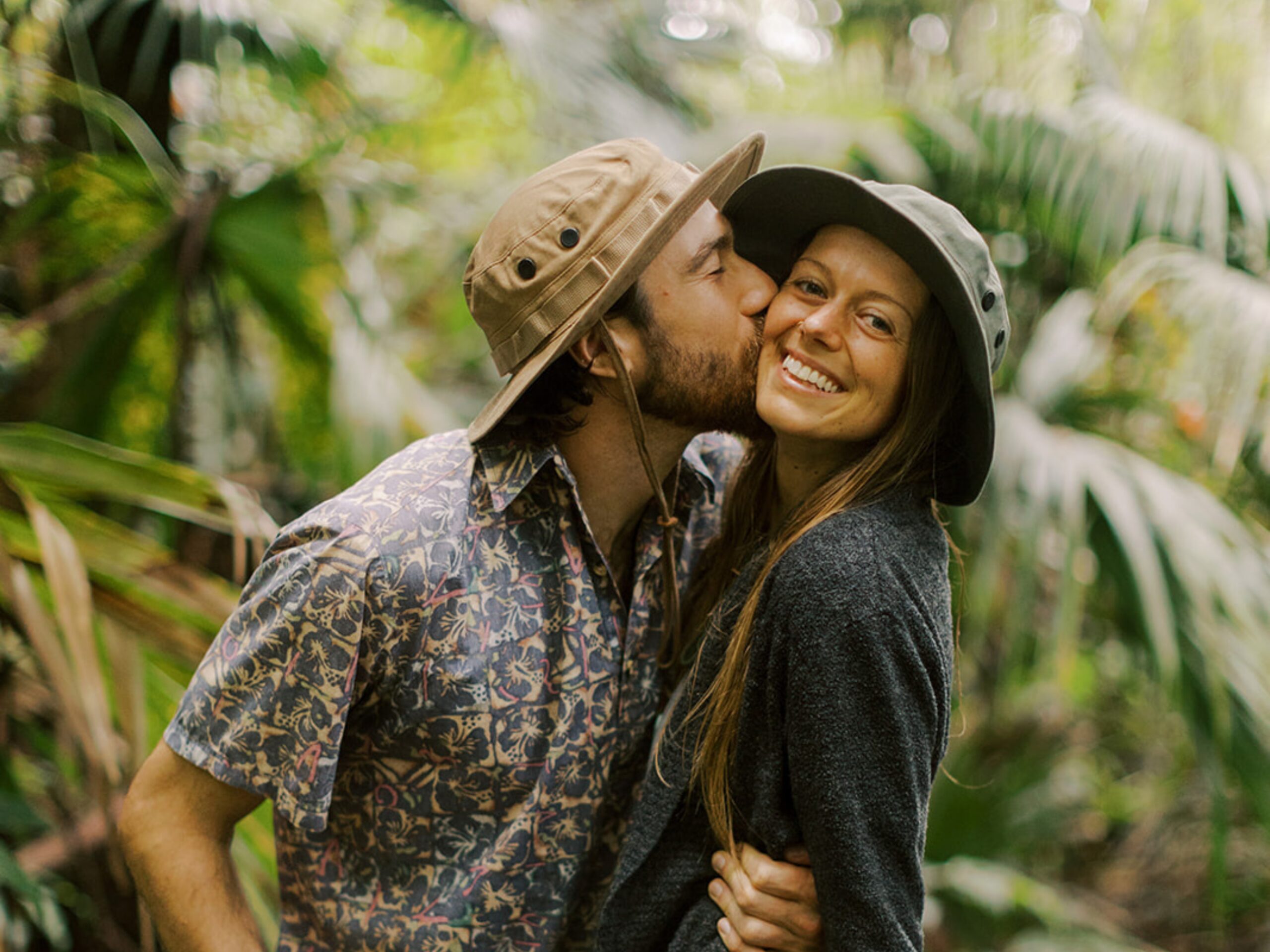 A couple embracing inside a cloud forest.