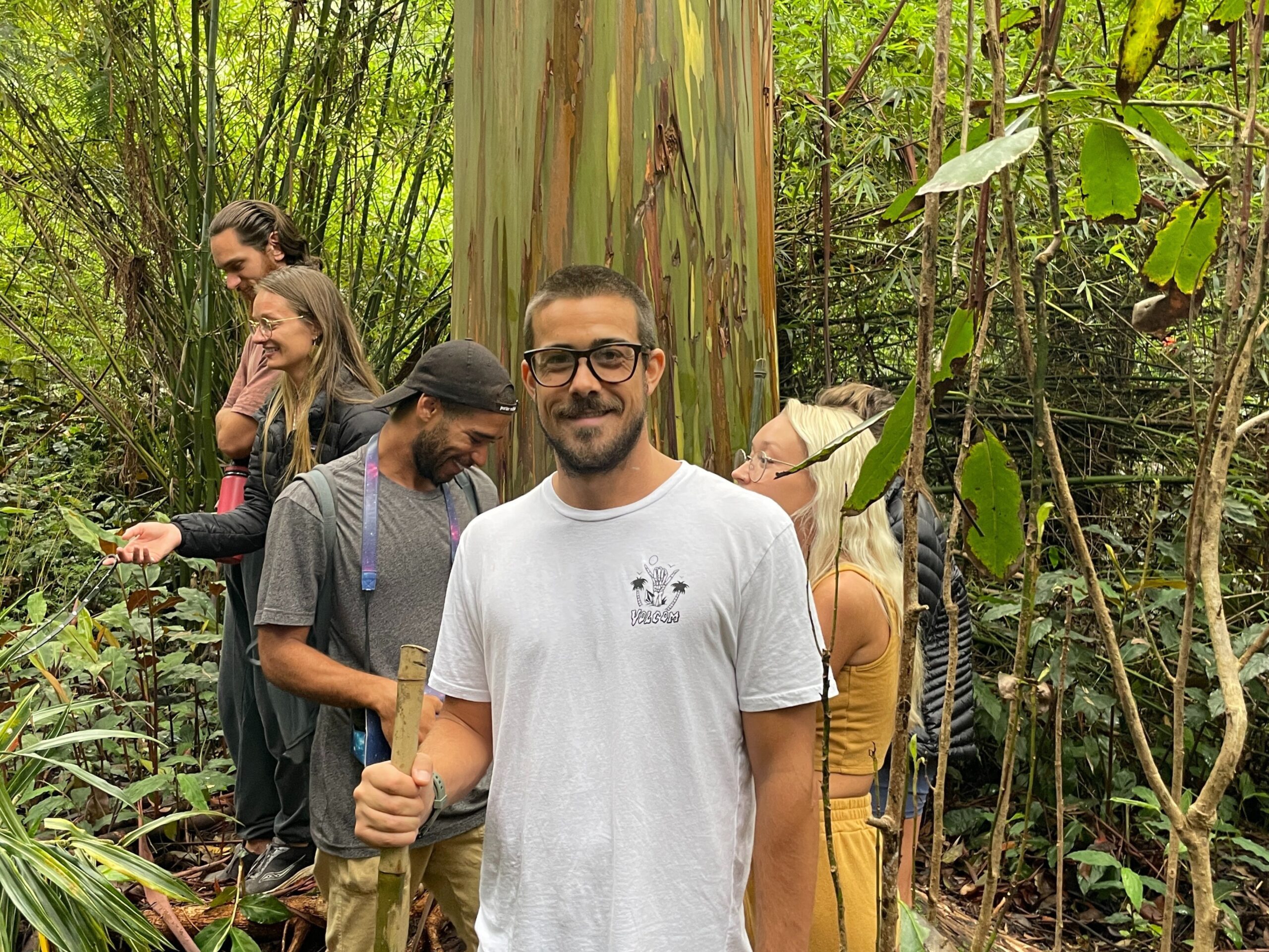 a group of people enjoying their botanical tour through the Kona Cloud Forest Sanctuary